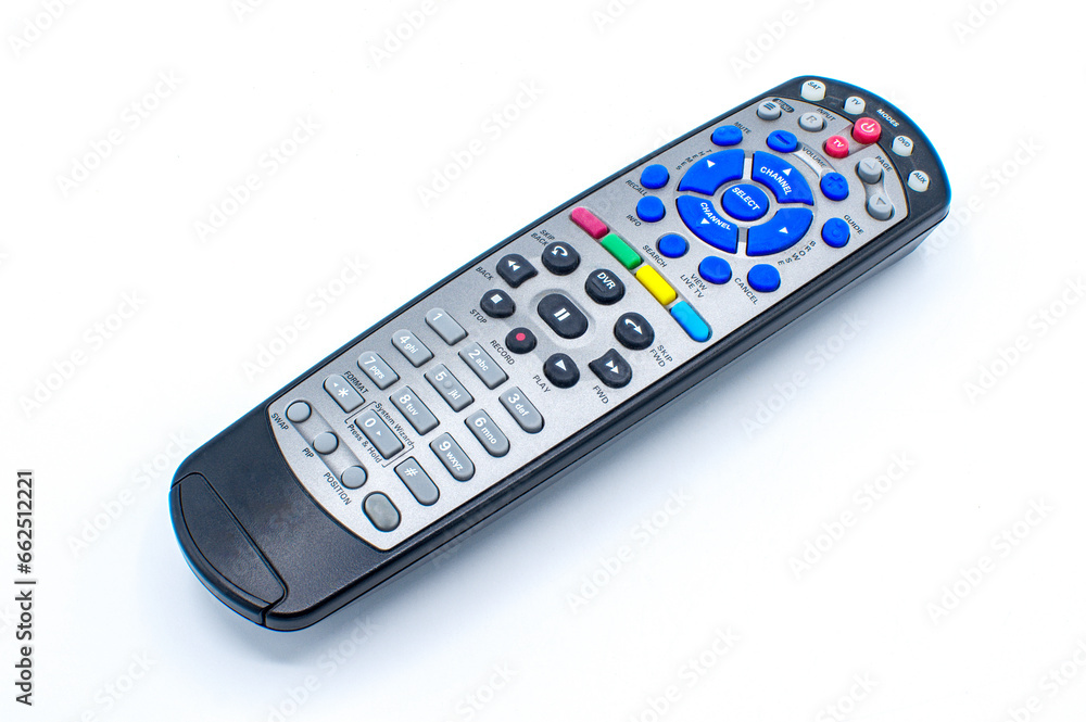 Black and silver remote control for tv, satellite, dvd, auxiliary, DVR or media center, with multiple color red, blue, yellow, green buttons on a white background Black and silver remote control for tv, satellite, dvd, auxiliary, DVR or media center, with multiple color red, blue, yellow, green buttons on a white background