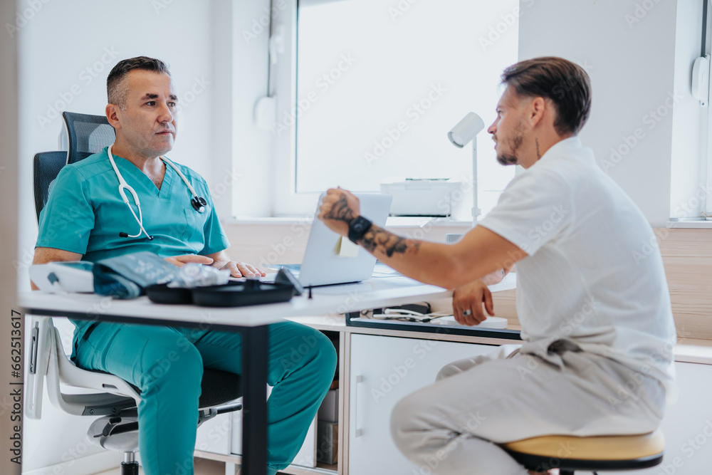 A doctor examines a young patient, discussing x-ray results in a medical office. A doctor examines a young patient, discussing x-ray results in a medical office.