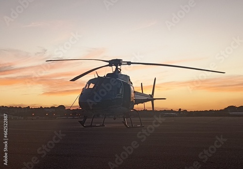 helicopter at sunset