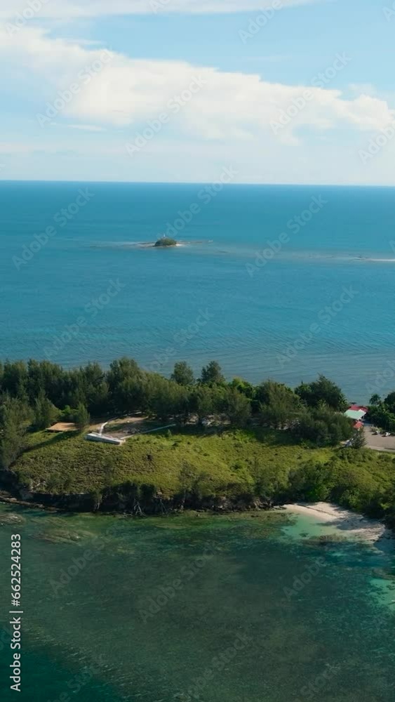 Aerial drone of Seascape with tropical sandy beach and blue ocean. The Tip of Borneo. Kalampunian Beach. Borneo, Malaysia. Aerial drone of Seascape with tropical sandy beach and blue ocean. The Tip of Borneo. Kalampunian Beach. Borneo, Malaysia.