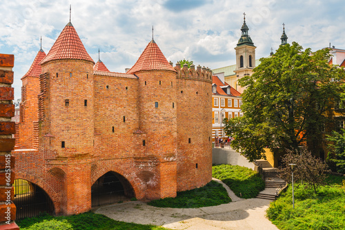 Old Town Warsaw. Towers and red brick walls of the historical Warsaw Barbican fort, Poland