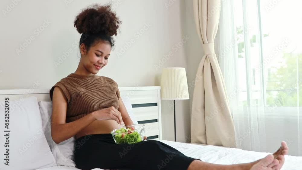 Young mother Thai-African descent eats healthy salad with vitamins and minerals. Vegetables that are beneficial to the body pregnant women and add nutrition to boost the health immunity of the fetus.
Young mother Thai-African descent eats healthy salad with vitamins and minerals. Vegetables that are beneficial to the body pregnant women and add nutrition to boost the health immunity of the fetus.