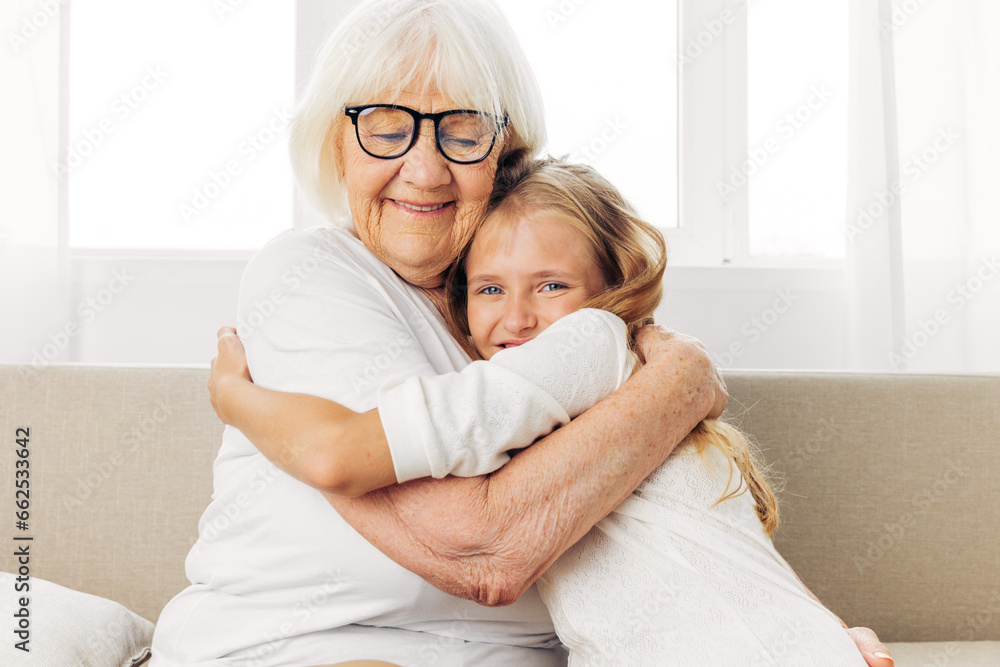 Home grandmother family child sofa girl couch granddaughter love happy Home grandmother family child sofa girl couch granddaughter love happy