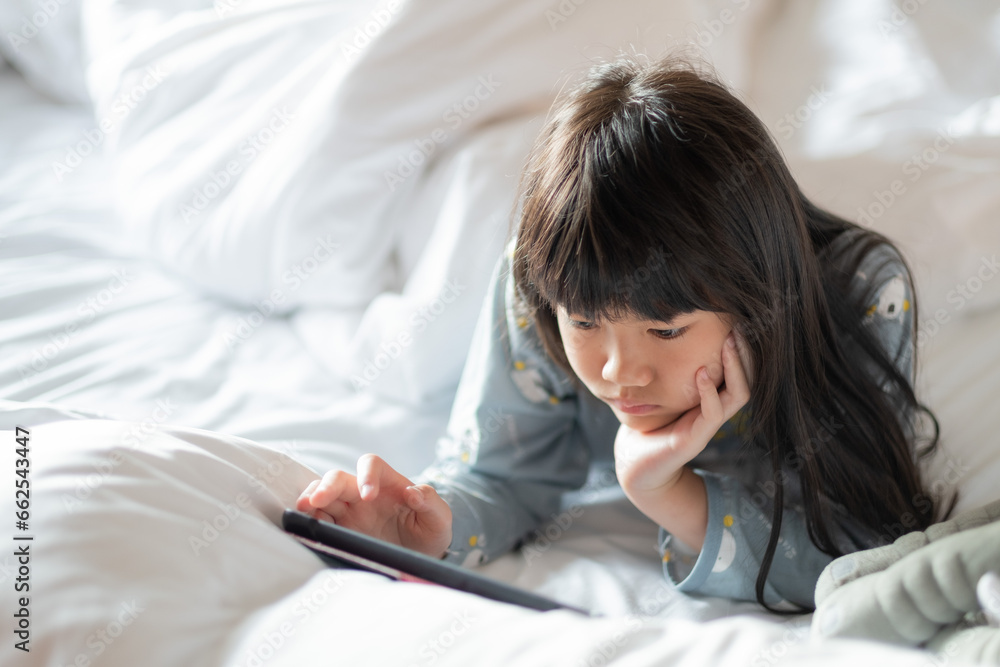 kid is addicted to tablet, little girl playing smartphone, kid use telephone, watching cartoon kid is addicted to tablet, little girl playing smartphone, kid use telephone, watching cartoon