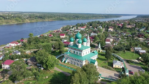 Top view of the Resurrection Cathedral and residential buildings, as well as the Volga River in the town of Tutaev, Russia.  photo