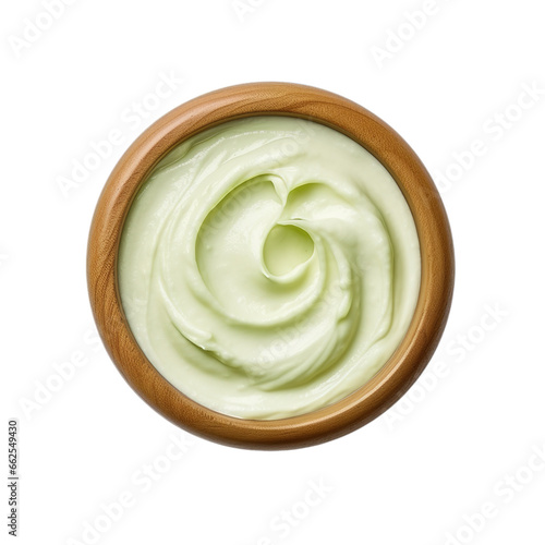 Top view of wasabi mayo dip in a wooden bowl isolated on a white background