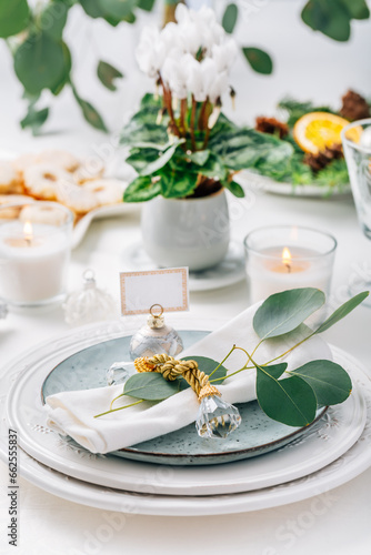 Festive Christmas setting, home table decoration in white and green