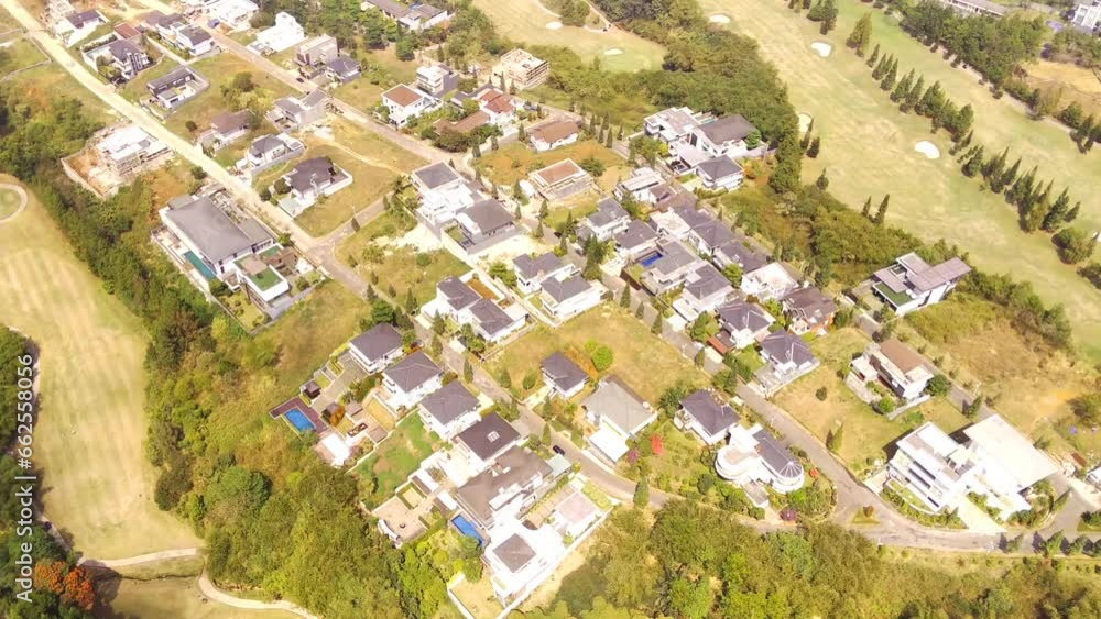 Golf Courses and elite housing. Drone video of a very wide golf course landscape surrounding the elite housing complex, Bojong Koneng - Bandung, Indonesia. Aerial Footage 4k Resolution Golf Courses and elite housing. Drone video of a very wide golf course landscape surrounding the elite housing complex, Bojong Koneng - Bandung, Indonesia. Aerial Footage 4k Resolution