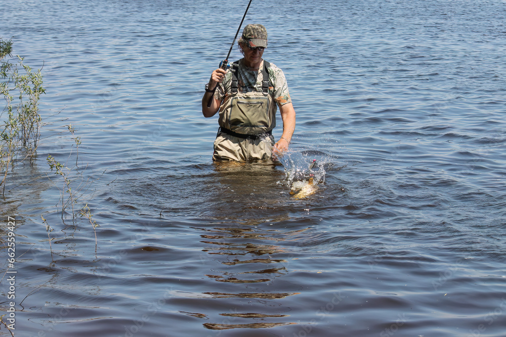 Fishing. One of a series of photos of fishermen catching northern pike. Fishing. One of a series of photos of fishermen catching northern pike.
