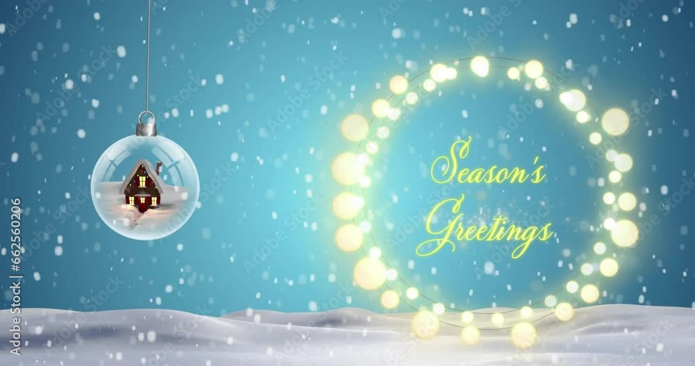 Animation of snow falling over hanging snowball and seasons greetings text over fairylights banner Animation of snow falling over hanging snowball and seasons greetings text over fairylights banner