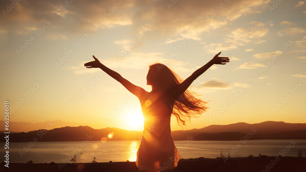 Fototapeta premium silhouette of person jumping on sunset