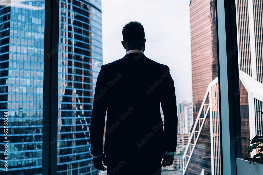 Fototapeta premium Confident male manager standing at window in office