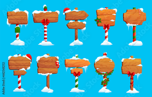 Christmas cartoon wooden signs, north pole and holiday sign boards. Vector set of wood street banners with snow caps, ice and icicles. Decorated Xmas winter pointers, banners, guideposts or billboards
