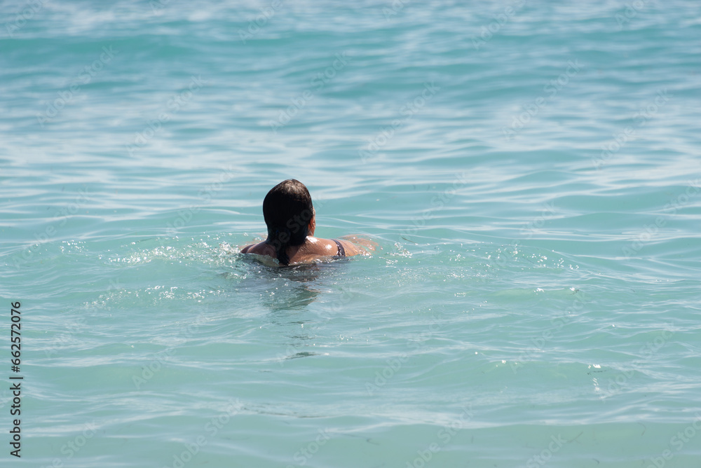 a woman swimming in the sea