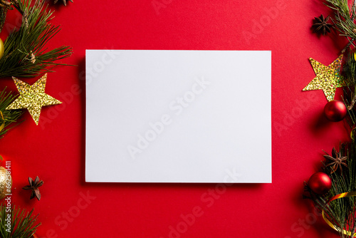 Christmas decorations with wthie card and copy space on red background