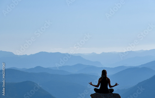 Silhouette of Young Woman Practicing Yoga