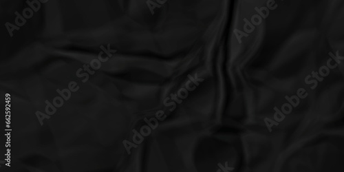 Dark crumple black fabric paper wrinkled poster template ,blank glued creased paper texture background. black paper crumpled backdrop background. used for cardboard and clarkboard.