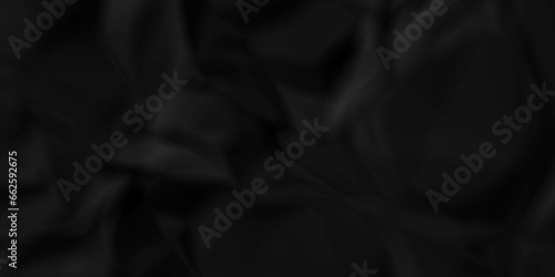 Dark crumple black fabric paper wrinkled poster template ,blank glued creased paper texture background. black paper crumpled backdrop background. used for cardboard and clarkboard.