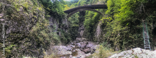 Spectacular bridge in Cheile Oltetului gorge, Polovragi, Gorj, Romania. Panoramic view. photo