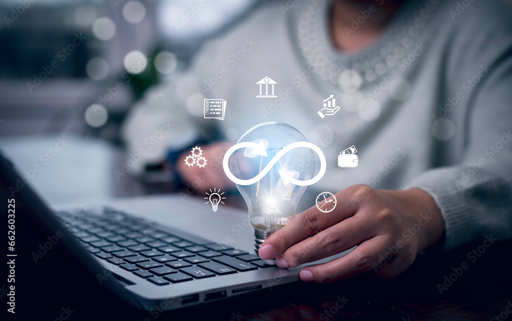 Naklejka premium Light bulb with Infinity symbol with technology global marketing online in business connection network economy strategy of investment, banking and financial data exchange for business growth.