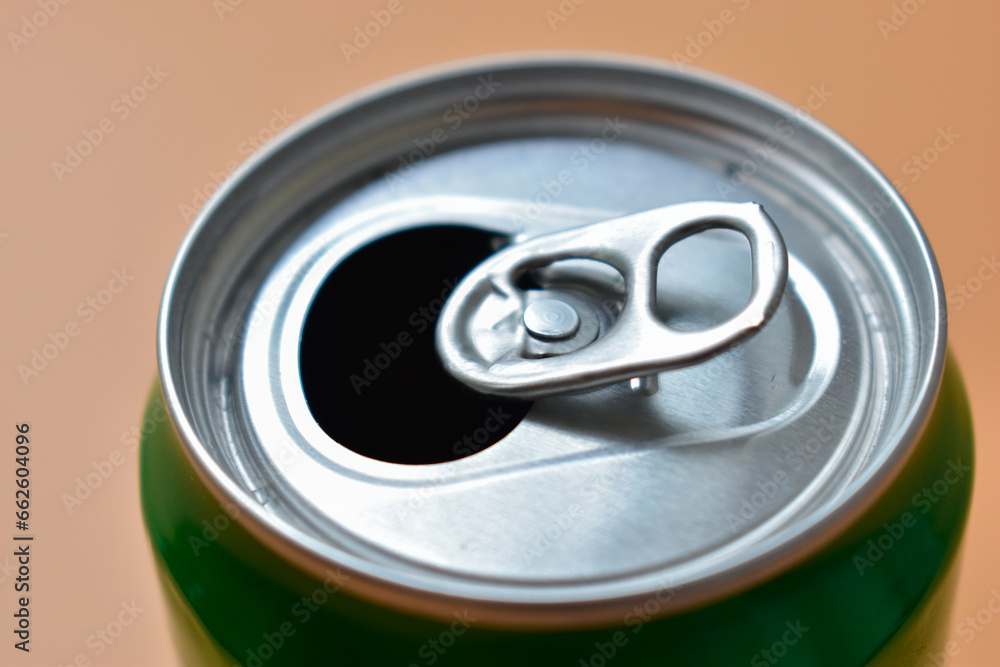 aluminum green drink cans on orange background, open cold fresh beverage aluminum green drink cans on orange background, open cold fresh beverage