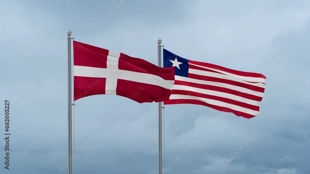 Liberia and Denmark flag waving together on cloudy sky, endless seamless loop, two country cooperation concept Liberia and Denmark flag waving together on cloudy sky, endless seamless loop, two country cooperation concept