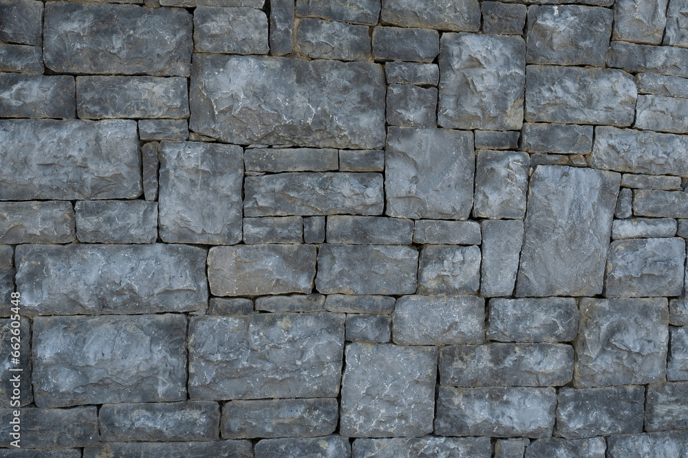 Fototapeta premium gray stone wall, weathered wall