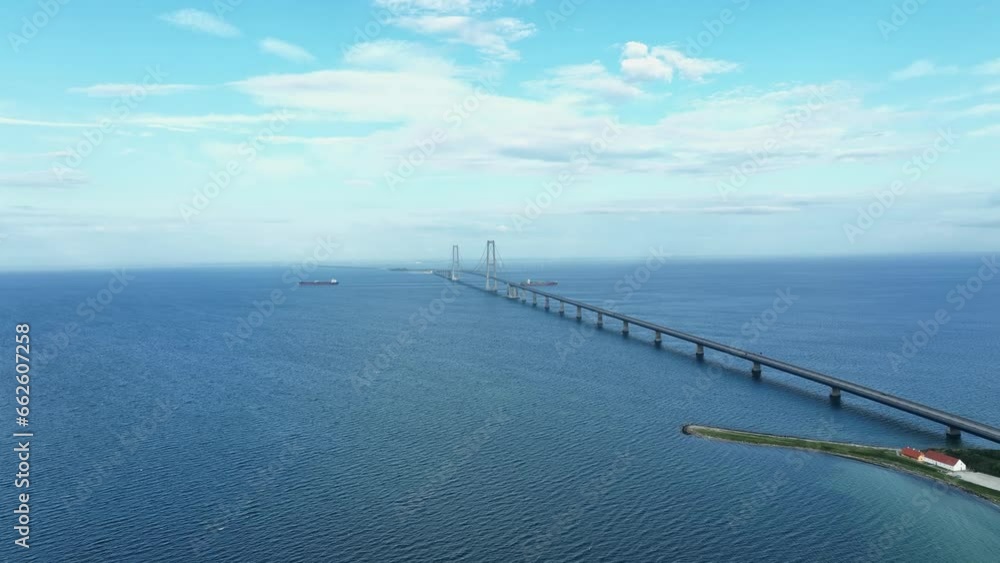 Great belt bridge fixed link crossing strait between islands of Zealand and Funen in Denmark - Stunning aerial with blue sky background Great belt bridge fixed link crossing strait between islands of Zealand and Funen in Denmark - Stunning aerial with blue sky background