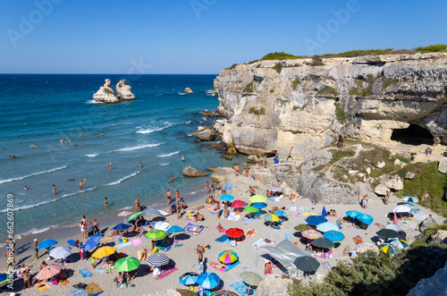 Fototapeta Naklejka Na Ścianę i Meble -  TORRE DELL'ORSO, ITALY, JULY 14, 2022 - View of the beach called of the Two Sisters in the village of Torre dell'Orso, province of Lecce, Puglia, Italy
