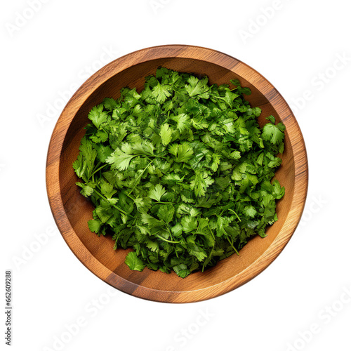 top view of cut cilantro in a wooden bowl isolated on a white transparent background