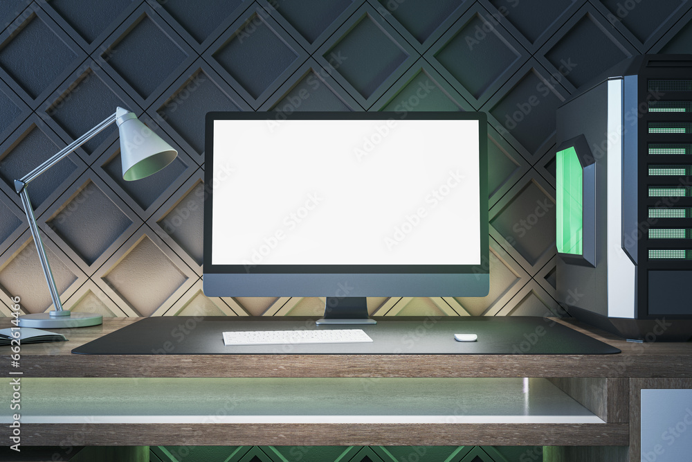 Creative gamers desktop with empty white computer screen, lamp and system unit on decorative black wall background. Gaming concept. Mock up, 3D Rendering.