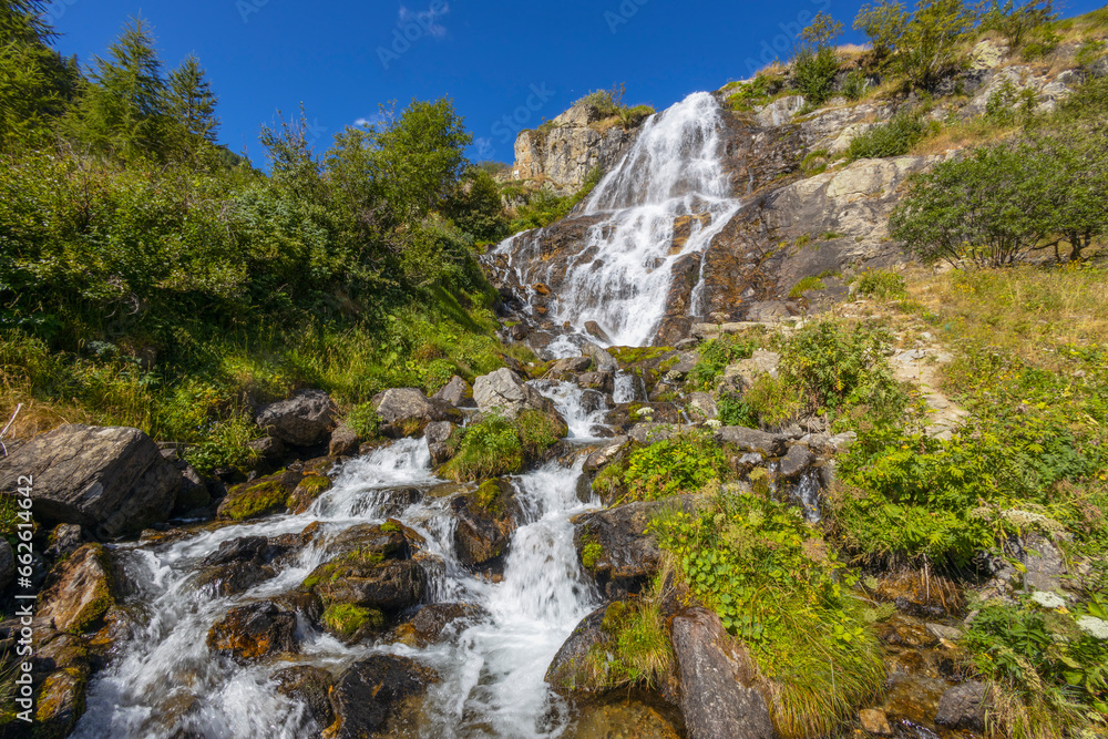 View of Pisciai waterfall in the municipality of Vinadio, province of Cuneo, Piedmont, Italy. View of Pisciai waterfall in the municipality of Vinadio, province of Cuneo, Piedmont, Italy.