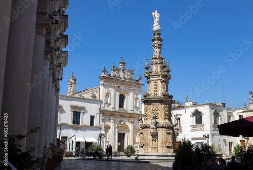 NARDO', ITALY, JULY 17, 2022 - View of the church of Saint Tryphon (San Trifone) and the Spire of the Immaculate  in the center town of Nardò, province of Lecce, Puglia, Italy photo