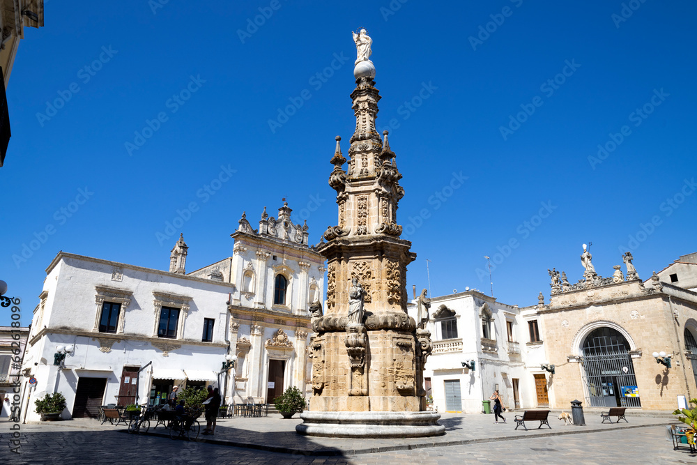 NARDO', ITALY, JULY 17, 2022 - View of the church of Saint Tryphon (San Trifone) and the Spire of the Immaculate  in the center town of Nardò, province of Lecce, Puglia, Italy