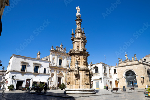 NARDO', ITALY, JULY 17, 2022 - View of the church of Saint Tryphon (San Trifone) and the Spire of the Immaculate  in the center town of Nardò, province of Lecce, Puglia, Italy © faber121