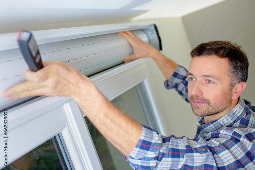 a man is fixing blind a man is fixing blind