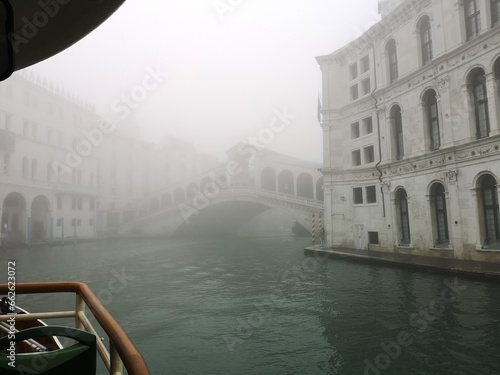 View of Rialto Bridge in the fog from a waterbus (vaporetto), Venice Veneto, Italy photo