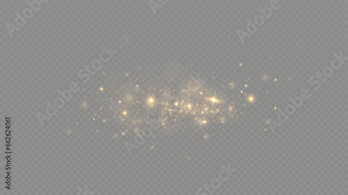 Golden sequins glow with many lights. Glittering dust. Luxurious background of golden particles.