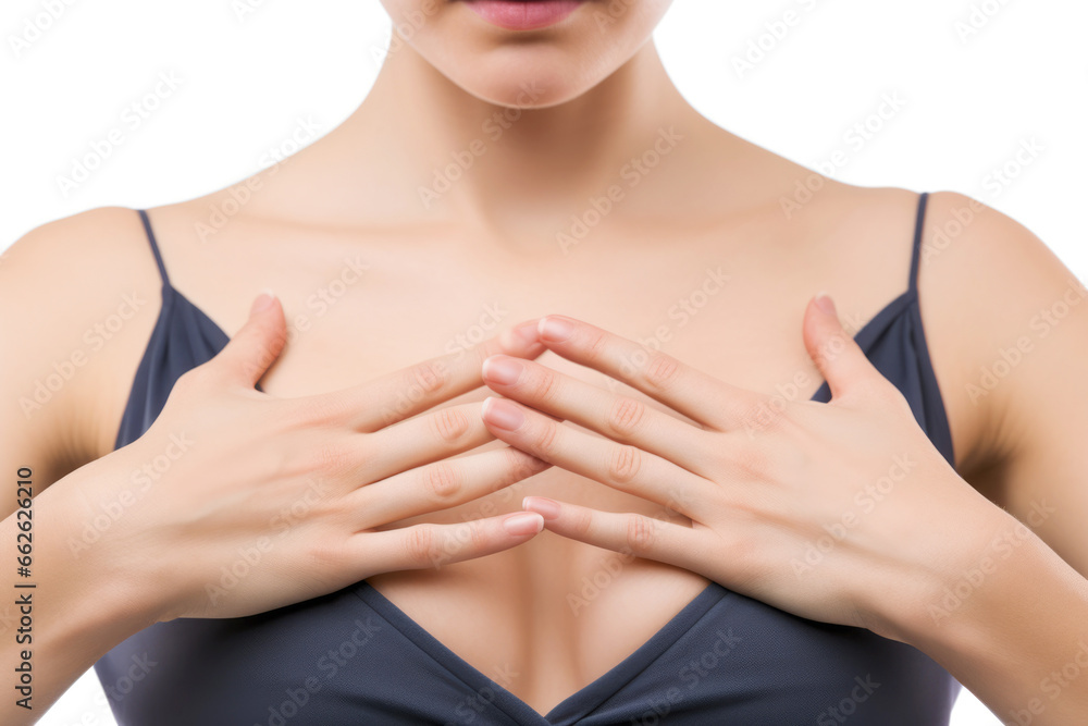 A close-up view of a female's hand touching her chest, highlighting the significance of self-awareness and breast health care.