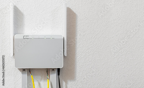 Dual-band home router attached to the wall, copy space