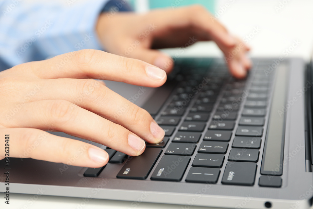 Laptop keyboard and hands on white background, close up Laptop keyboard and hands on white background, close up