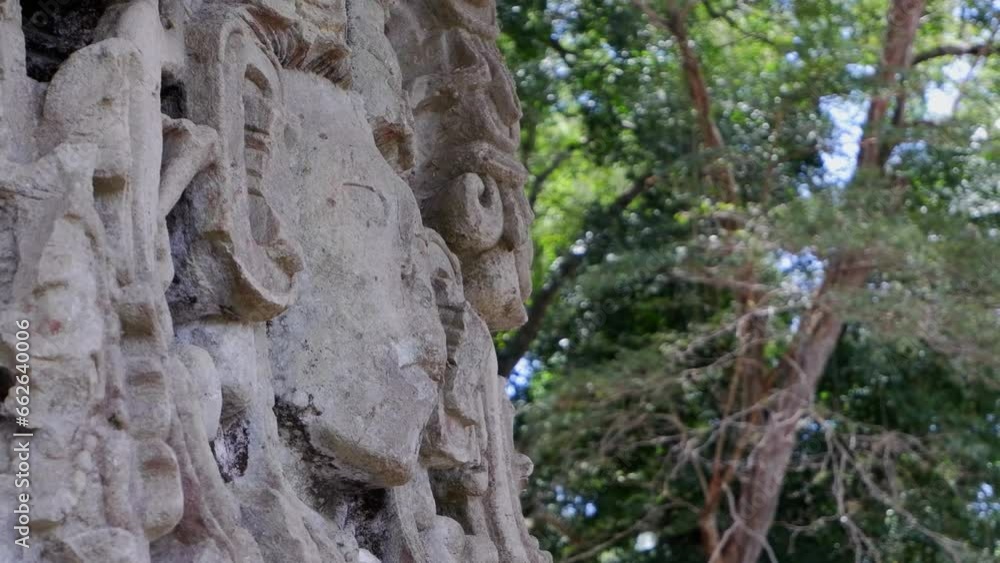 Close detail: Carved stone face of Mayan king at Copan ruin, Honduras Close detail: Carved stone face of Mayan king at Copan ruin, Honduras
