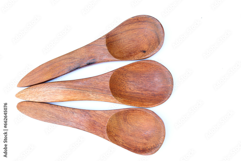 Three wooden spoon on white background top view Three wooden spoon on white background top view