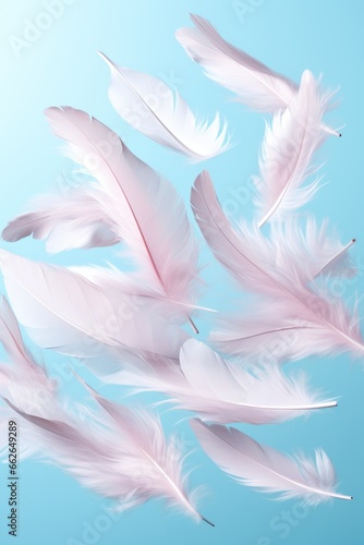 white feathers fly in the air on blue pastel background