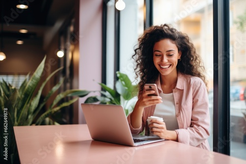 Happy female student sitting in a coffee shop, using a smartphone or business, online shopping, transfer money, financial, internet banking. in coffee shop cafe over blurred background. photo