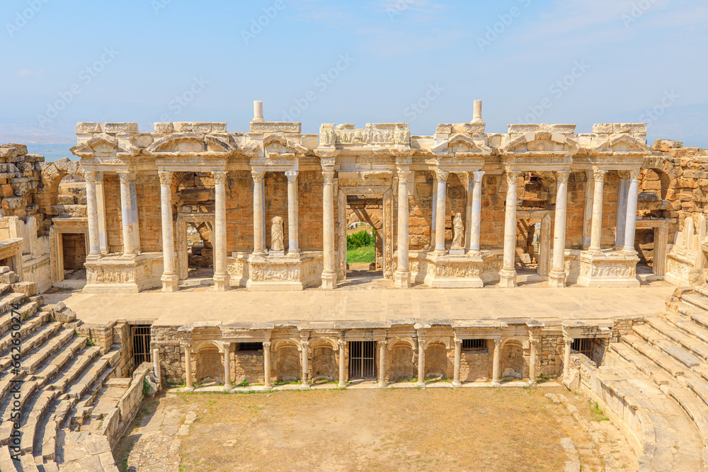Obraz premium Theater of Hierapolis in Pamukkale, Turkey. It once hosted 15,000 spectators, drawing crowds for diverse performances, echoing the vibrant history of this remarkable site.