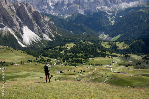 Mountain view with climber, Seceda mountain, Dolomites, Italy.