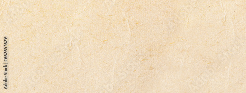Texture of beige old paper, crumpled background. Vintage craft parchment cardboard.