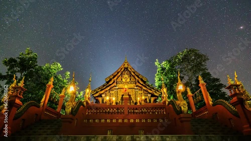 night sky Meteor shower and satellites visible above Wat Phra That Doi Phra Chan, Lampang Province, Thailand.