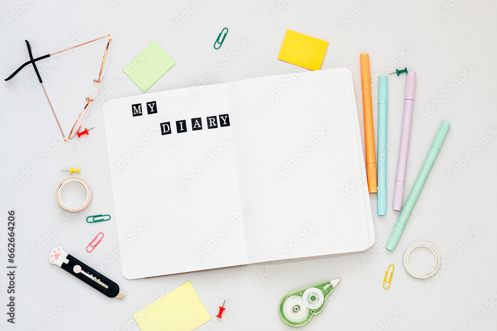 Filling in the diary, the inscription My Diary in the notebook in a dot Filling in the diary, the inscription My Diary in the notebook in a dot